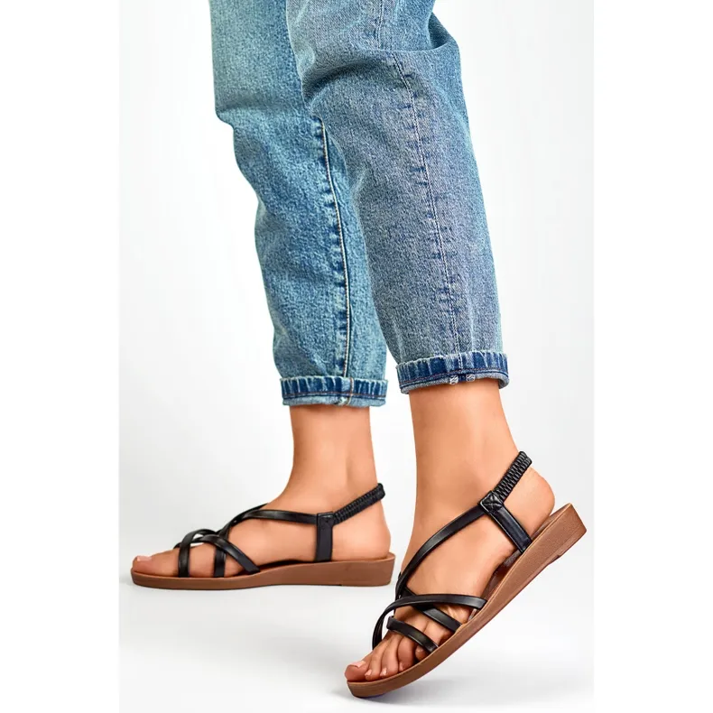 Black women's sandals with a flat sole