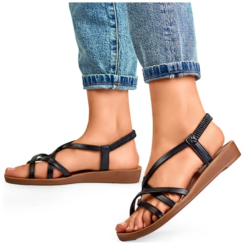 Black women's sandals with a flat sole